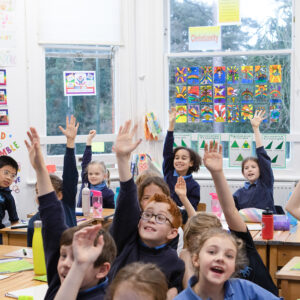 students raising their hand