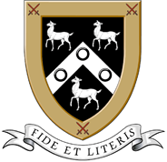 Coat of arms: gold border, black shield with two white goats atop a white chevron with three black roundels, motto banner ‘Fide et Literis’ below.